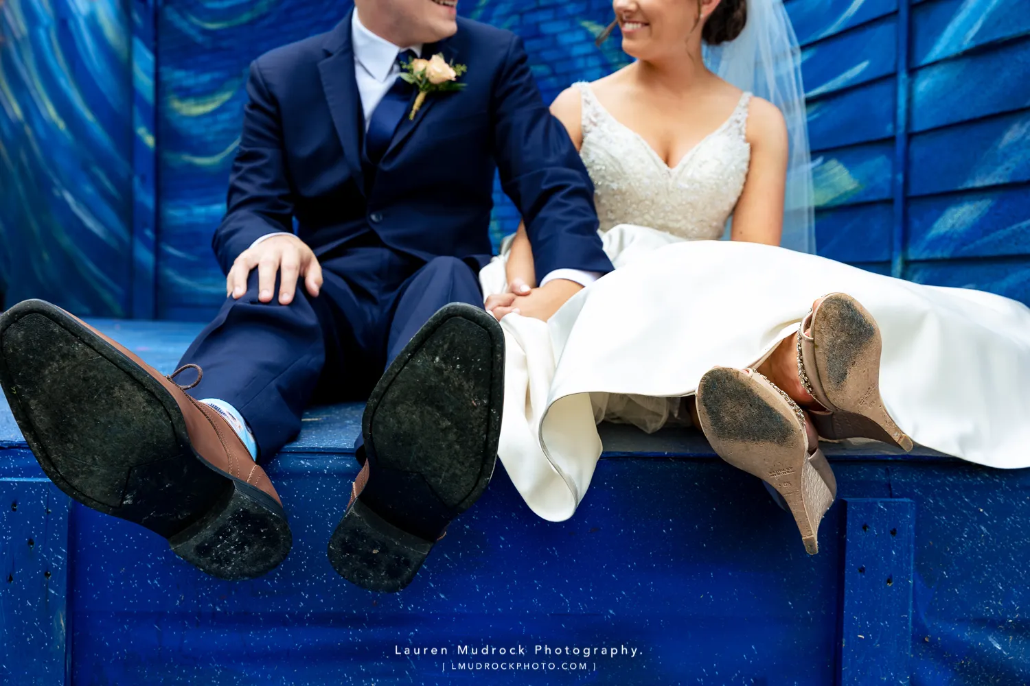 bride groom feet on blue stage
