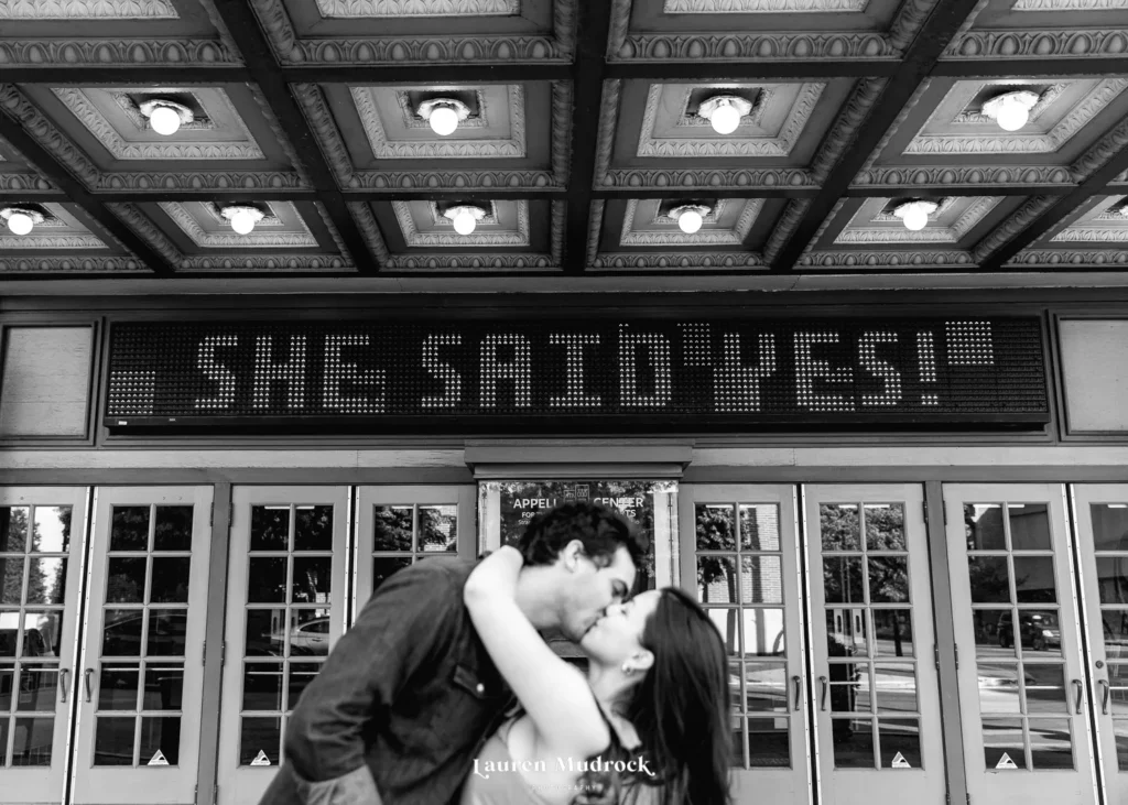 kissing in front of she said yes marquee